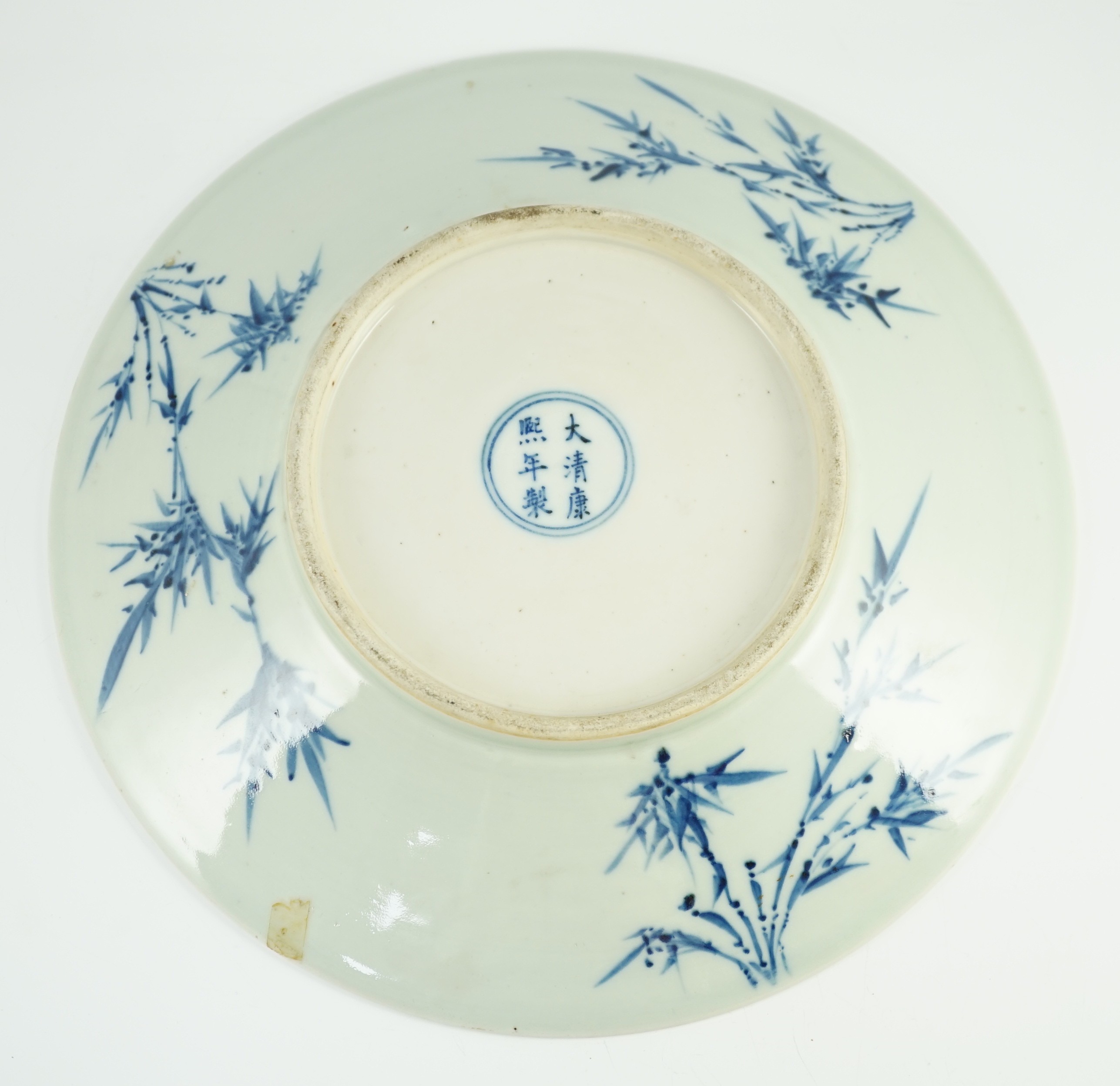 A Chinese blue and white dish, Kangxi mark, 19th century, 34.5cm diameter